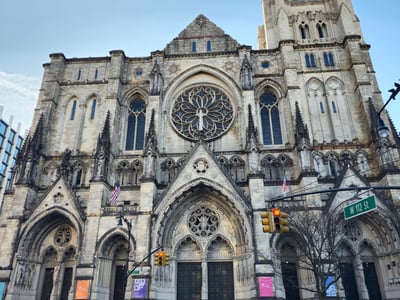 St John the Divine Cathedral in New York, famous for its impressive Gothic architecture and beautiful rose windows.