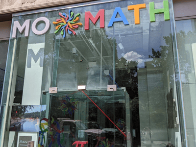 Colorful and modern entrance of the National Museum of Mathematics in New York, illustrating the interactive appeal of mathematics.
