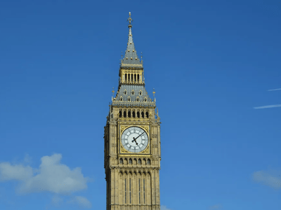 The iconic Big Ben clock tower stands majestically against a blue sky, a symbol of London's architectural heritage.
