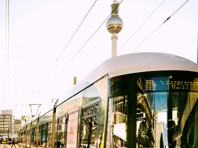 Tram at Alexanderplatz, with the Television Tower in the background, an iconic symbol of Berlin.