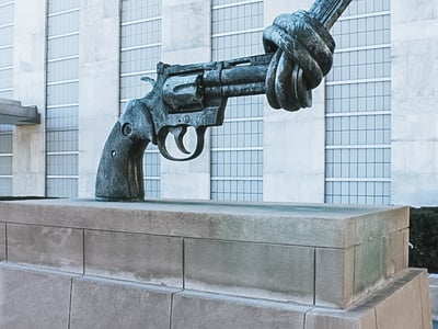 Sculpture of a knotted revolver, a symbol of peace, in front of the United Nations building in New York.