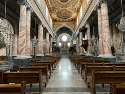 Majestic interior of the Cathedral of Castellaneta, showcasing beautiful columns and an ornate ceiling.
