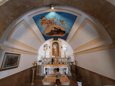 Interior view of St. Elias Church, highlighting the beautiful altar and the colorful fresco above.