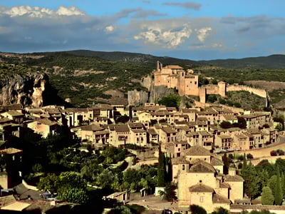 Historic village of Alquézar with its stone houses and castle, nestled in a picturesque valley.