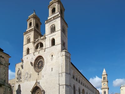View of the Cathedral of Santa Maria Assunta, famous for its Romanesque architecture and its two majestic bell towers.