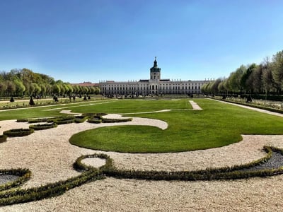 Impeccable gardens of Charlottenburg Palace, illustrating baroque architecture in the heart of Berlin.