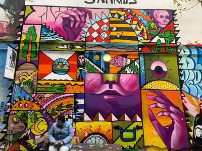 Colorful and vibrant wall at Haus Schwarzenberg, showcasing contemporary street art and its creative atmosphere.