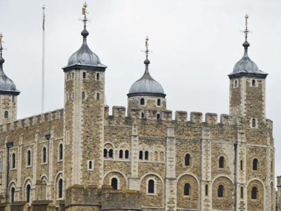 Detailed view of the Tower of London, a famous historical monument, with its distinctive turrets and medieval architecture.