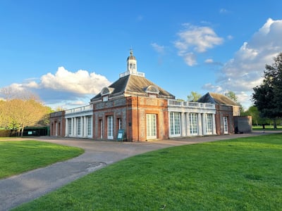 Serpentine Gallery with its distinctive architecture, surrounded by greenery, offering a popular cultural space in London.