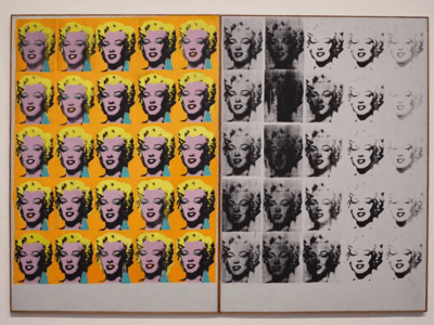 Iconic silkscreens of Marilyn Monroe by Andy Warhol, displayed at the Tate Modern in London, illustrating pop culture.