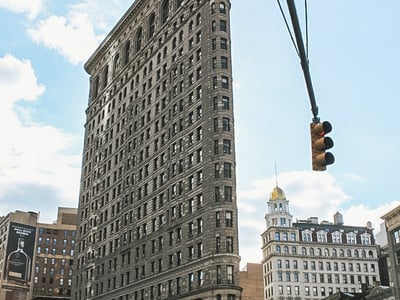 View of the Flatiron Building in New York, famous for its unique architecture and iconic location.