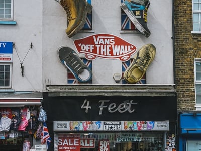 4 Feet shop in Camden Market, with Vans shoes and a colorful display attracting visitors.
