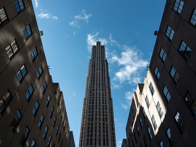 Impressive view of the Rockefeller Center, highlighting its iconic architecture against a bright blue sky.