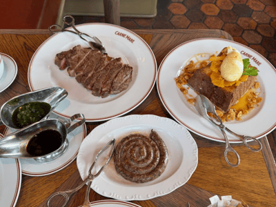 Juicy meat dish and tasty dessert, served at Pier 17 restaurant, showcasing local cuisine.