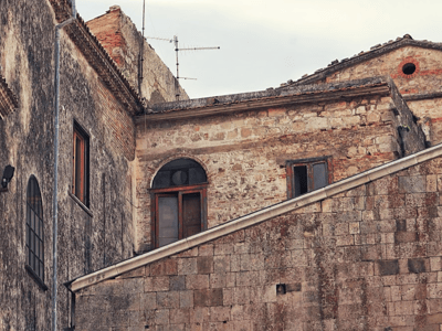 View of the old facades near the Cathedral of Bovino, illustrating the historical architecture of the region.