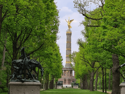 Verdant path of Tiergarten Park leading to the Victory Column, with an equestrian statue in the foreground.