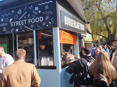 Lively street food stand at Camden Lock Market, offering delicious burgers to hungry visitors.