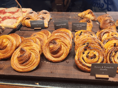 Chocolate croissants and delicious cornettos displayed in a Chelsea Market shop, perfect for a gourmet break.