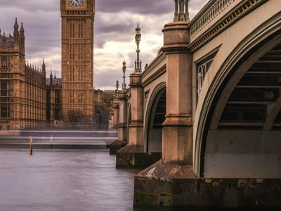 View of Big Ben and the bridge over the River Thames in Westminster, evoking the iconic architecture of London.