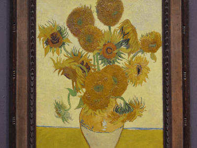 Vibrant bouquet of sunflowers by Van Gogh, displayed at the National Gallery, celebrating the beauty of flowers.