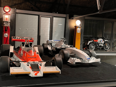 Iconic racing cars on display at the Bilmuseum, showcasing the evolution of Formula 1 over the years.