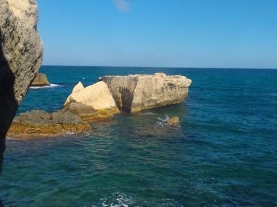 Turquoise waters and iconic rocks of Roca Vecchia, offering a spectacular view of the Adriatic Sea.