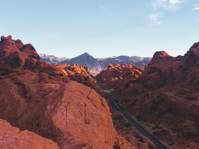 Impressive landscapes with glowing hues in the Valley of Fire, with mountains in the background.