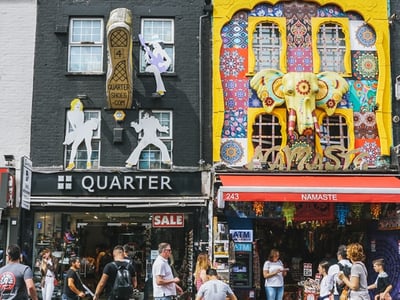 Colorful facade of Camden Market, showcasing lively shops and vibrant artistic decorations.