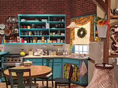 Iconic FRIENDS cuisine, with colorful shelves and a table, recreating the friendly atmosphere of New York.
