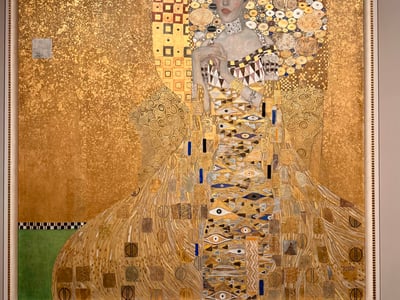 Portrait of a Woman by Gustav Klimt, exhibited at the Neue Galerie, captivating with its golden style and ornamental patterns.