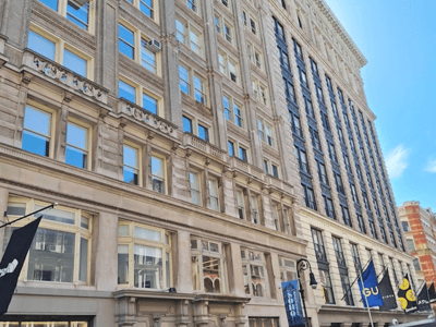 Historical façade of a building at Big Bus Tours New York, illustrating classic New York architecture.