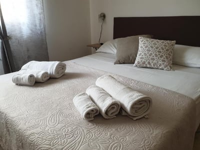 Welcoming room at B&B Vacanze Salento, with neatly folded towels on a comfortable bed.