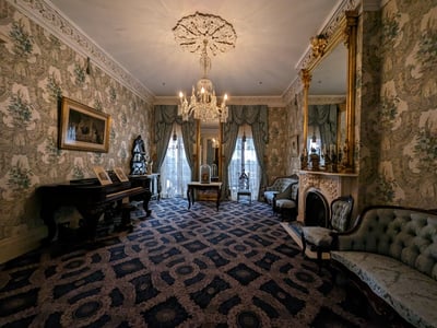 Elegant interior of Theodore Roosevelt's birthplace, showcasing its refined furnishings and historical decor.