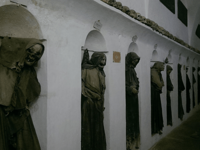 Mummies on display in the crypt of the Cattedrale Santa Maria Assunta a Cielo, testifying to the local religious history.
