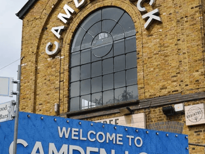 Entrance arch of Camden Lock Market, famous for its shops and vibrant culture in London.