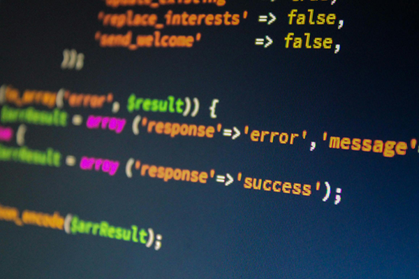 Run the Latest Stable Version of PHP A computer screen displays colorful PHP code highlighting variables and functions for handling error and success messages.
