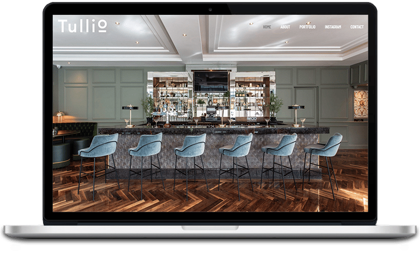 Tullio designs of modern furniture design table, displaying a screenshot of text on its chair in an indoor setting.