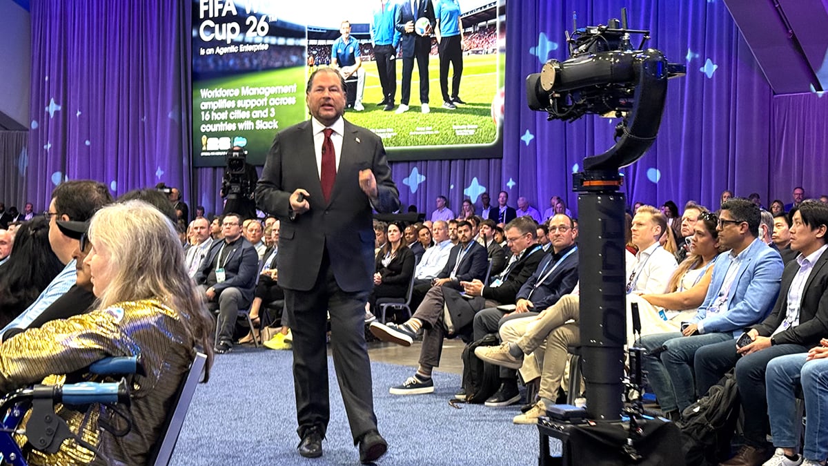 Salesforce CEO Marc Benioff walks the runway through the audience during the Dreamforce 2026 keynote at Moscone Center, San Francisco, September 15, 2026, the day Salesforce unveiled AIforce, with a "FIFA World Cup 26 is an Agentic Enterprise" slide on the screen and a broadcast camera crane in the foreground
