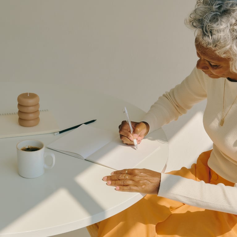 Older woman writing in a journal