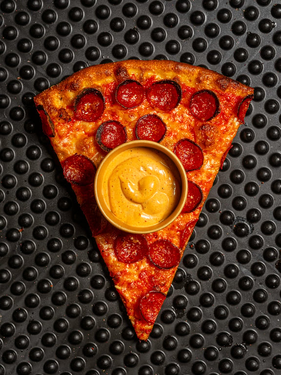 A slice of Tree House pizza on the counter
