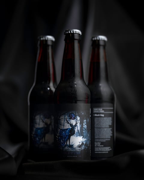 Black Stag is our German Doppelbock, pouring a dark amber color with a crown of coffee-colored foam.