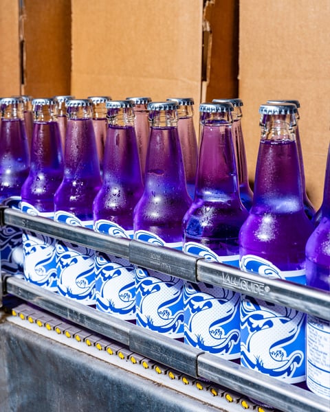 A sunny day and fresh Razzy clears on the bottling line.