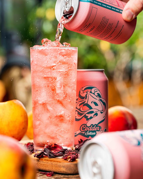 Codder Seltzer is super dry from real hibiscus flowers and even juicier from a burst of peach!