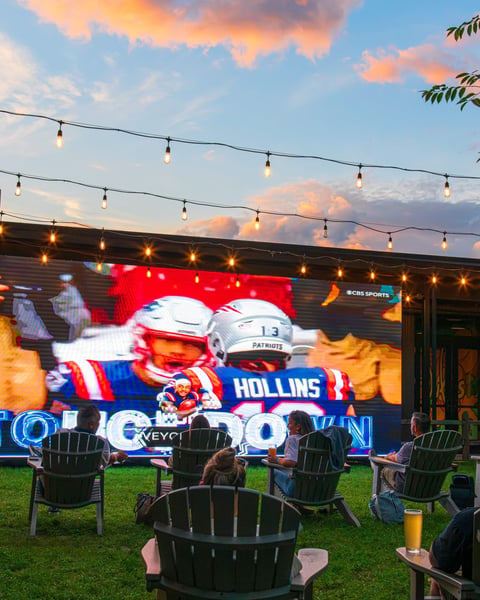 we’ve always wondered what it would be like to watch the pats outside on a 27 foot wide video wall, so we got one.