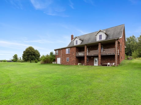 An image featuring sky, plant, building, property, window, cloud, tree, natural landscape, house, land lot at 2899 Overton Rd.