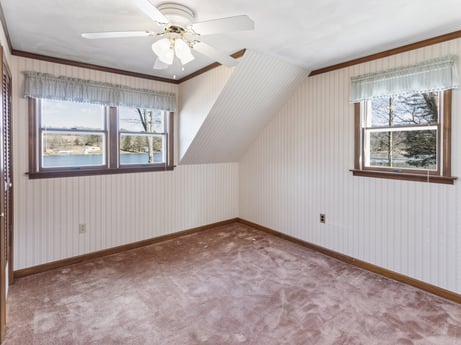 An image featuring window, ceiling fan, building, fixture, wood, hall, interior design, floor, wood stain, flooring at 199 S Lake Rd.