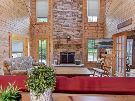 An image featuring furniture, plant, couch, picture frame, table, flowerpot, houseplant, wood, interior design, brick at 1761 Brick House Rd.