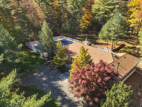 An image featuring plant, building, tree, natural landscape, larch, window, slope, landscape, house, real estate at 125 Rimstone Ct.