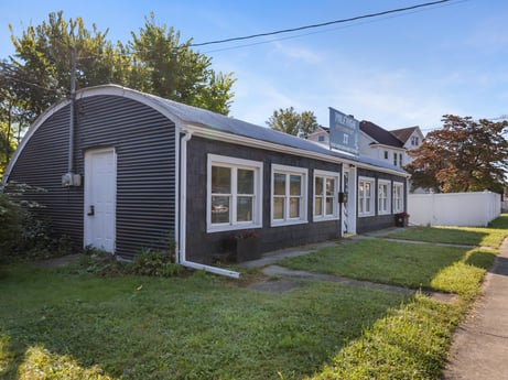 An image featuring plant, sky, property, building, cloud, window, tree, land lot, cottage, house at 302 N Keystone Ave.