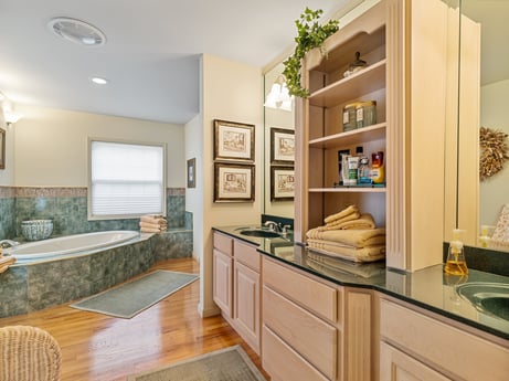 An image featuring cabinetry, countertop, wood, drawer, floor, flooring, shelf, houseplant, house, hardwood at 218 Point Rd.